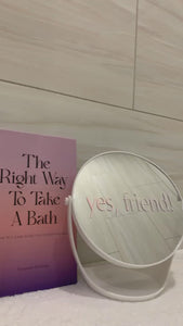 Positive affirmation pink mirror decal without air bubbles on white bathroom mirror. Instagram boomerang of decal for daily positive affirmation. Mirror affirmation decal placed on modern white mirror for bathroom. White mirror for bathroom has a tray for skincare products.
